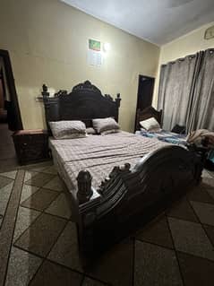 King size wooden bed with side tables