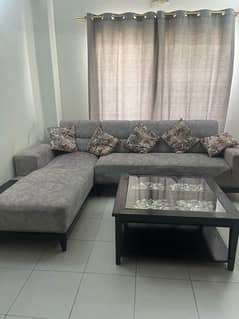 L shape sofa with beautiful table stones and marble inside