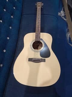 Yamaha F310 T guitar in wooden style . in new condition .