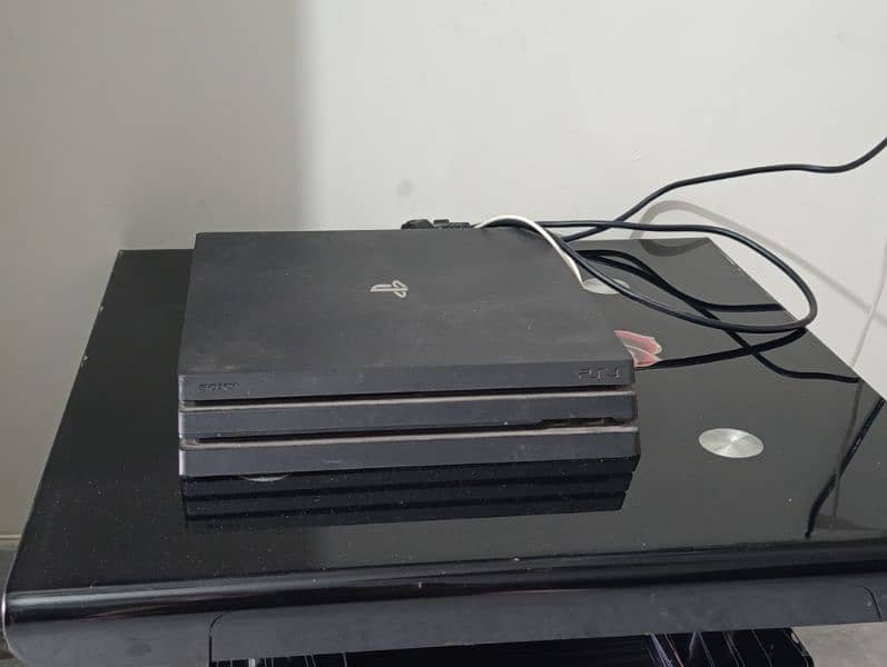 ps4 pro 1 tb console with two controllers and monitor 2