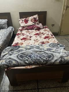 Wooden single beds
