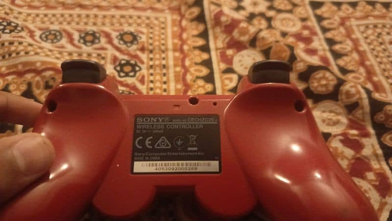 PS3 with games and controller 1
