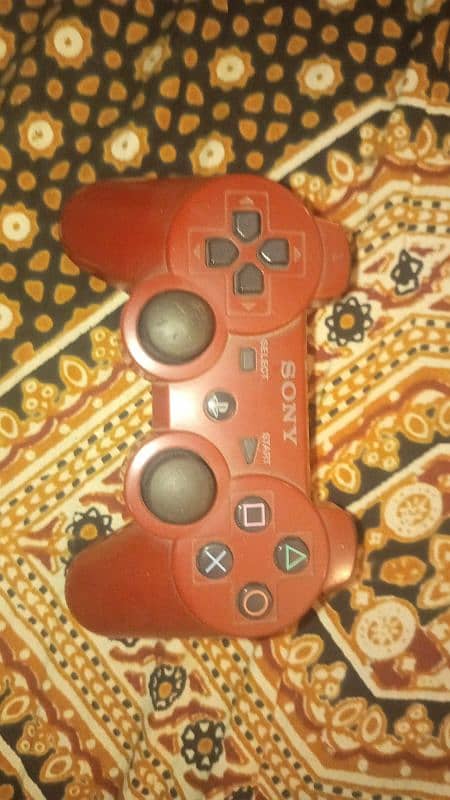 PS3 with games and controller 2