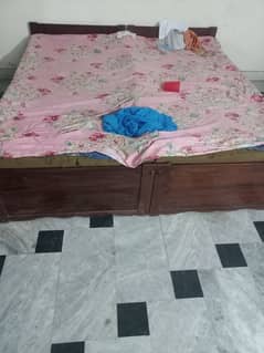2 single bed along with table and mitror