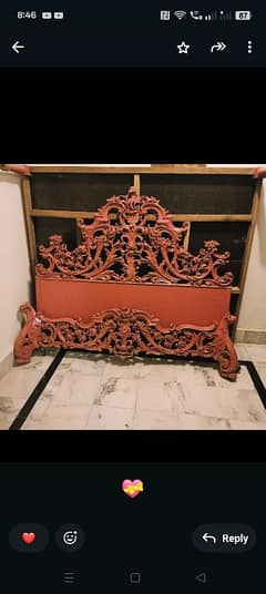Wooden bed with carving