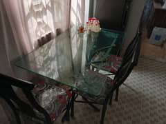Metal dining table with 4 chairs.