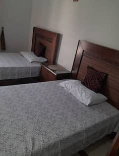 2 wooden beds w one side table and 2 molty foam mattress