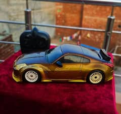 gold and brown RC (radio-controlled) model of a Nissan 350Z