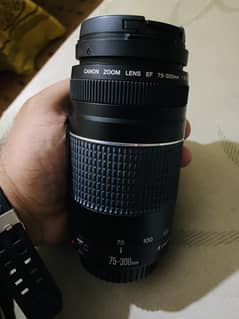 Canon 1300D with 18-55mm, 50mm, 75-300mm