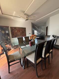 Glass top eight seater dining table