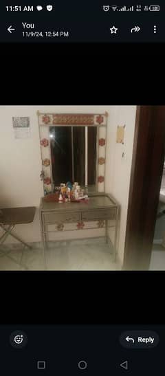 iron made queen size bed along with side tables and dressing table