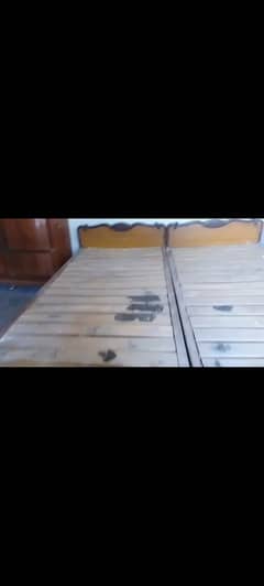 two single beds use but solid wood