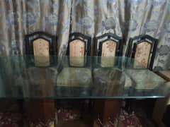 6 Seater Dining Table and Chairs. Wooden and glass dining table.