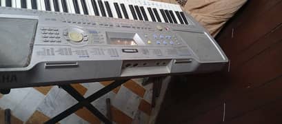 Yamaha piano along with stand