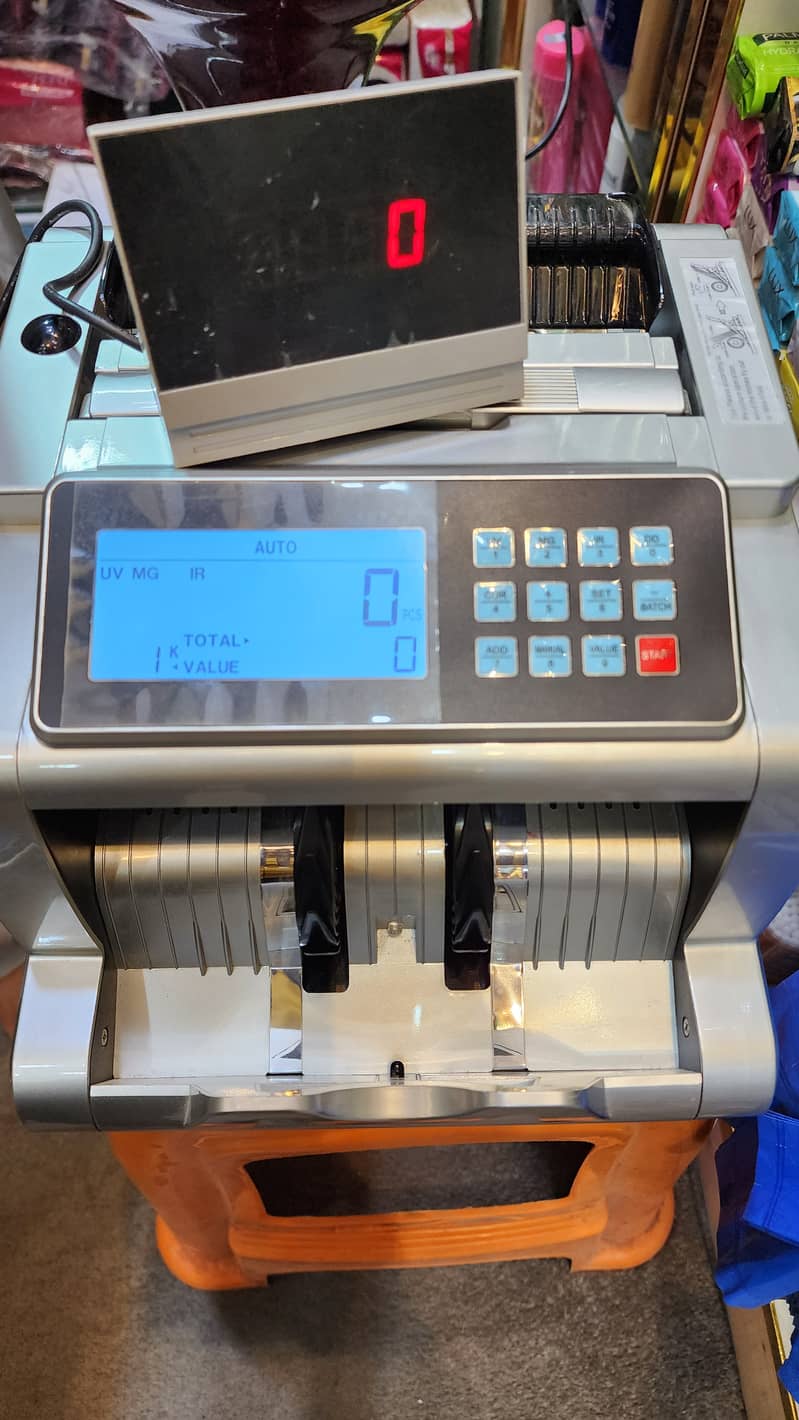 Cash counting machine with fake note detection 5