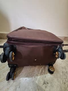 Brown Suitcase with Dual Spinner Wheels