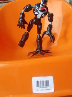 Goku, Luffy, and Venom action figures
