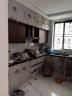 10 Marla Tile Floor House is For rent in Wapda Town Phase 1 Block E2.