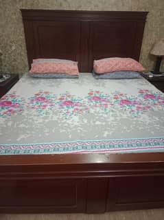 Bed with two site tables