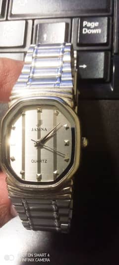 a Jasina brand watch with a stainless steel back