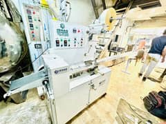 Packing Machine Tikky Pack Kulfi Biscuit DairyMilk Cocomo Scotch Bride