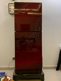 red refrigerator okay condition and neat