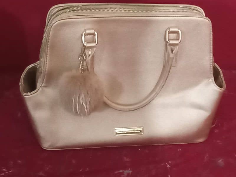 dull golden handbag 0