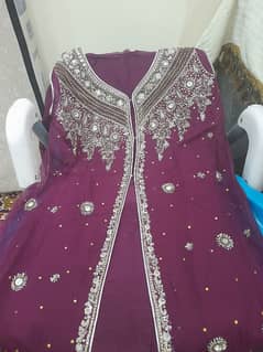 Delicate work on chiffon and in coat style with long back.