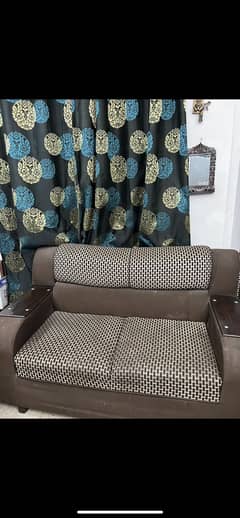 Brown color sofa set. Green color sofa set