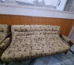 A wooden sofa 3 to 1 seater.  contact:- 03064013616