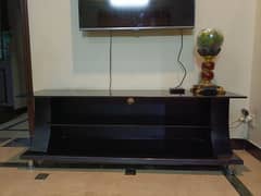 Glass top Tv console Dark theme