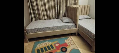 Two single beds with spring mattress