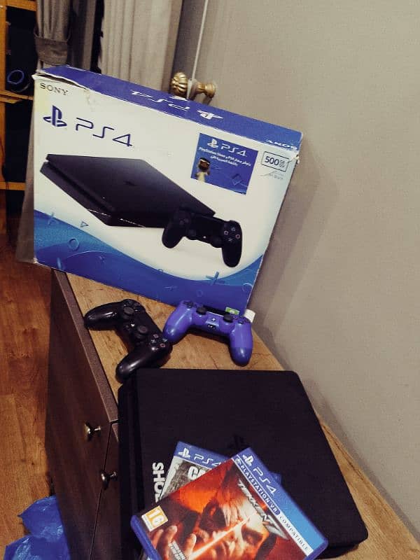ps4 slim w 2 controllers and games in very good condition 1