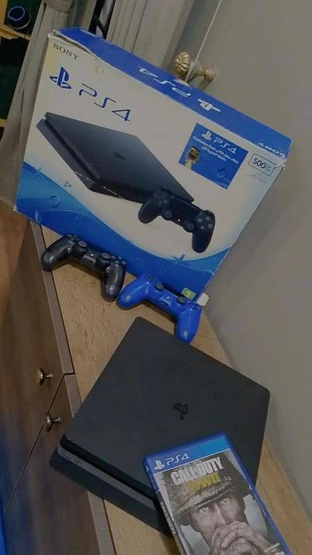 ps4 slim w 2 controllers and games in very good condition 4