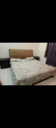 wooden floor king size bed matres side tables 2 chairs dresng mirror