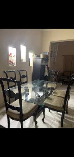 dinning table with 6 wooden chairs
