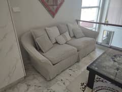 sofa from Artech home . light weight feather filling. loose cover