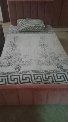 A pair of two single beds