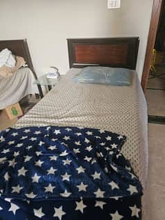 2 beds and a dressing table