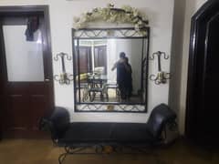 Metal framed mirror with Sofa and candles with stand