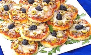 homemade Mini pizza and chicken vegetable rolls.