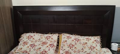 Double bed with 1 side table and L shape dressig.