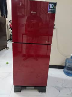 fridge, dryer machine, cupboard and bed