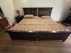 Singles beds with side table