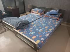 2 single beds with mattresses &  1 side table