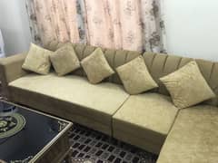 L shaped sofa with centre table is up for sale