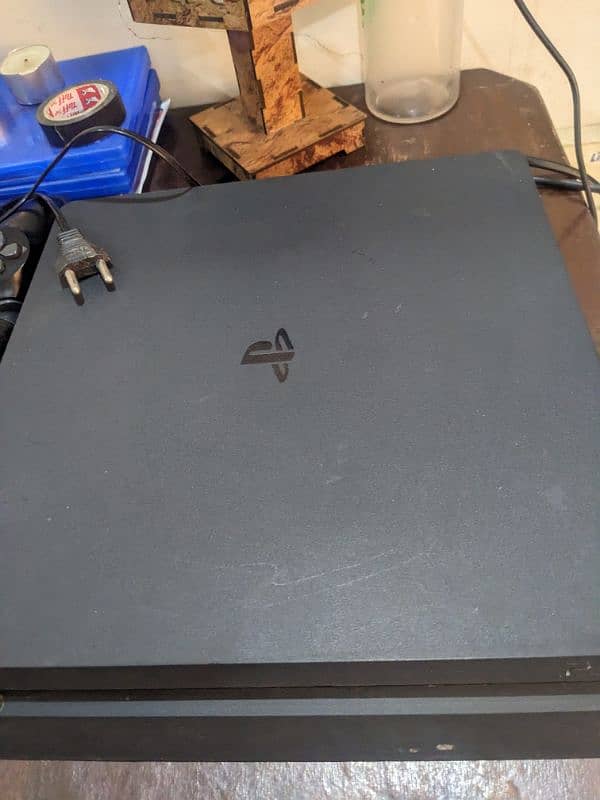 playstation 4 slim in perfect condition with two controllers 1