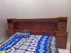 wood bed with attached side tables
