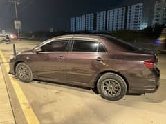 Corolla GLI 1.6 wine red color Total genuine only touchup one fender