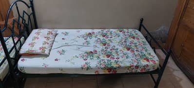 Two single beds with mattresses for sale